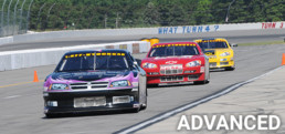 Three stock cars at Pocono Raceway