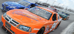 Four stock cars racing at Pocono Raceway