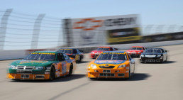 Side shot of stock cars racing at Pocono Raceway
