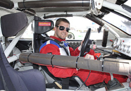 Male driver inside of stock car