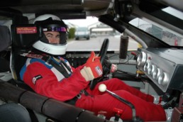Driver in cockpit of stock car